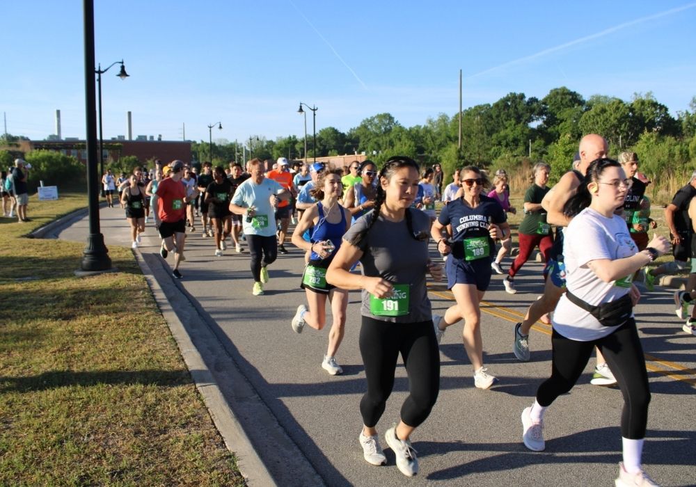 Group runners in morning sunlight — 2026 Strides for Autism