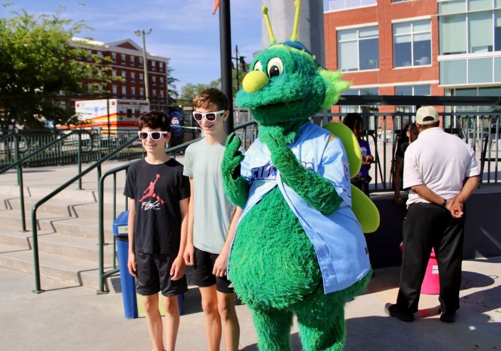 Mascot with boys participants — 2026 Strides for Autism