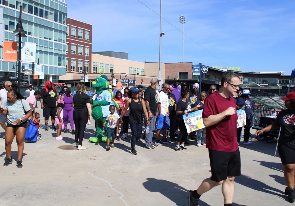 Mascot with participants — 2026 Strides for Autism