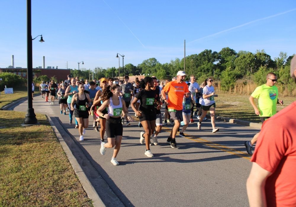 Runners in morning sunlight — 2026 Strides for Autism
